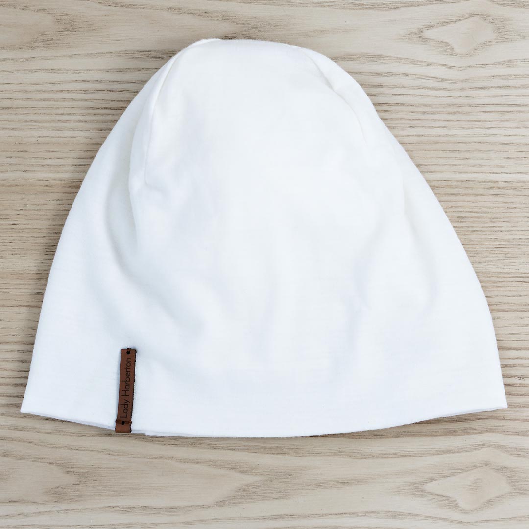 Le bonnet White Flag en laine mérinos blanche pour femme et